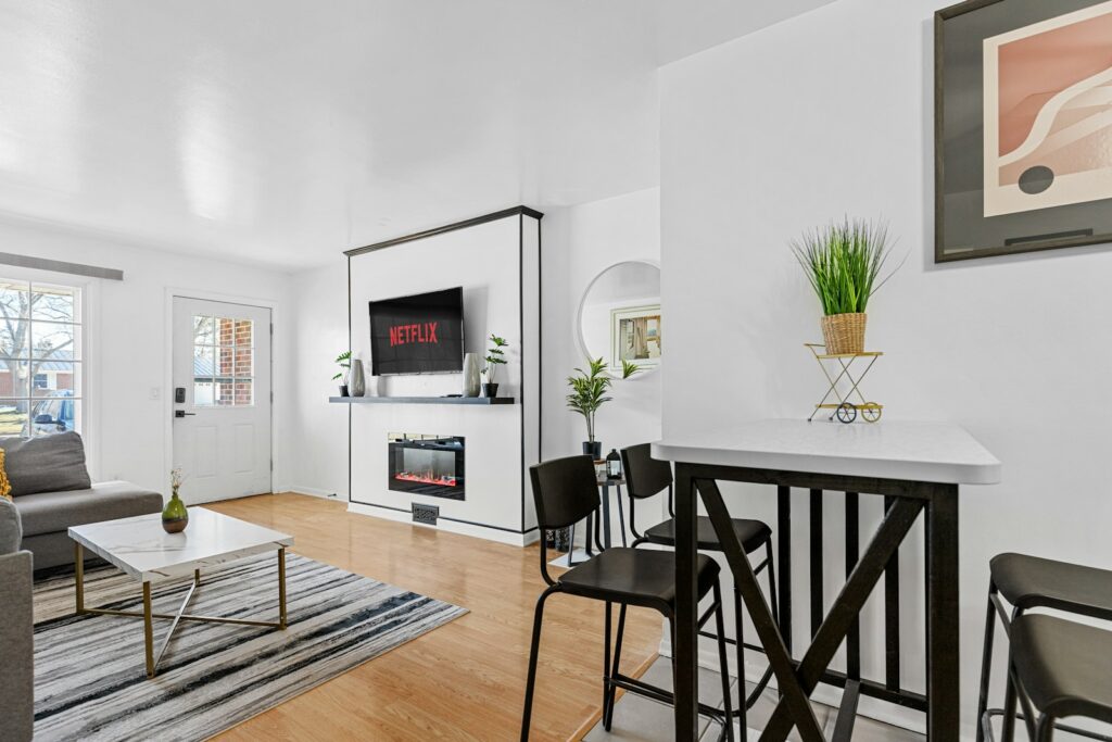 a living room filled with furniture and a flat screen tv